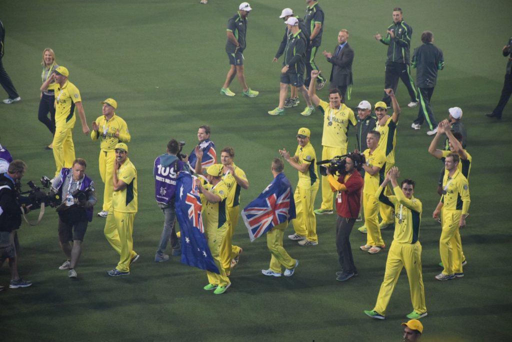 A victorious Australia National Cricket Team exits the field after defeating New Zealand at the 2015 ICC Men's Cricket World Cup in Melbourne